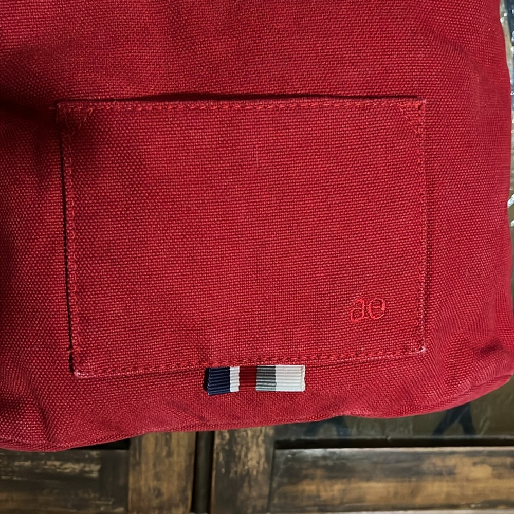 Vintage Y2K American Eagle red purse with multicolored striped ribbon accents. - Picture 2 of 6